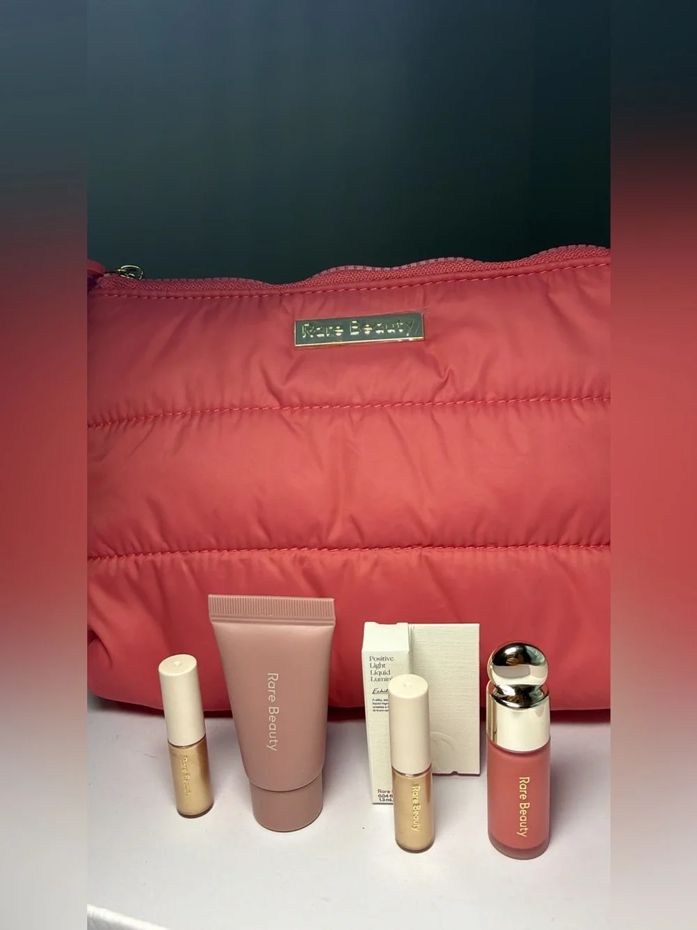 New,unused & authentic Rare Beauty Coral Pink Quilted Cosmetic Bag with samples